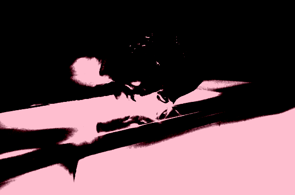 This image depicts an expressionless face emerging from the shadows to rest its cheek against a frosted glass counter that is backlit, as if a lightbox. The absent eyes look past the immaculate reflection that slices through the glass.